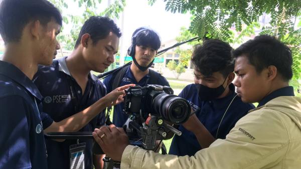 Film school students around a camera
